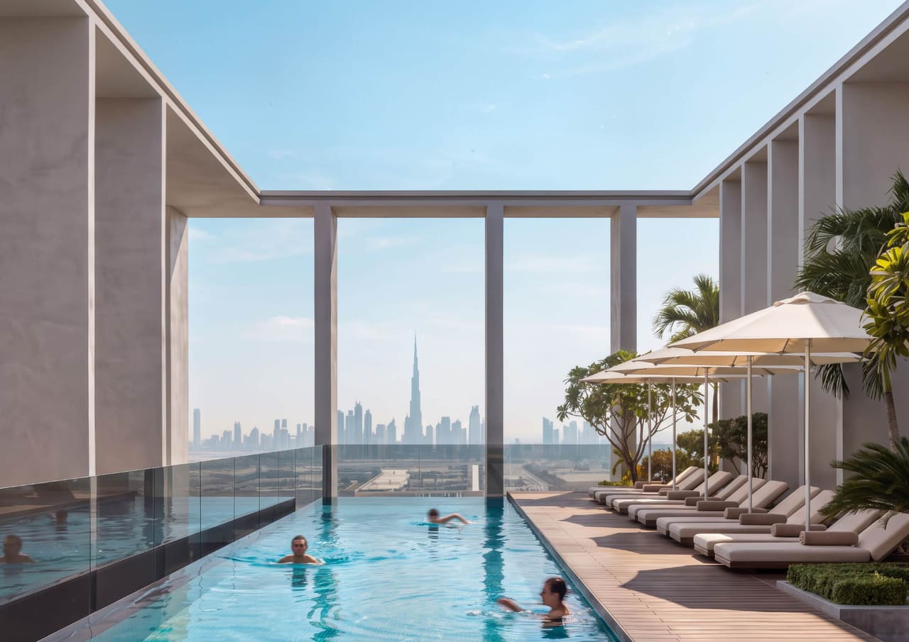 Render of the KORE rooftop pool and sun deck, framed by the building's frame with the Dubai skyline beyond